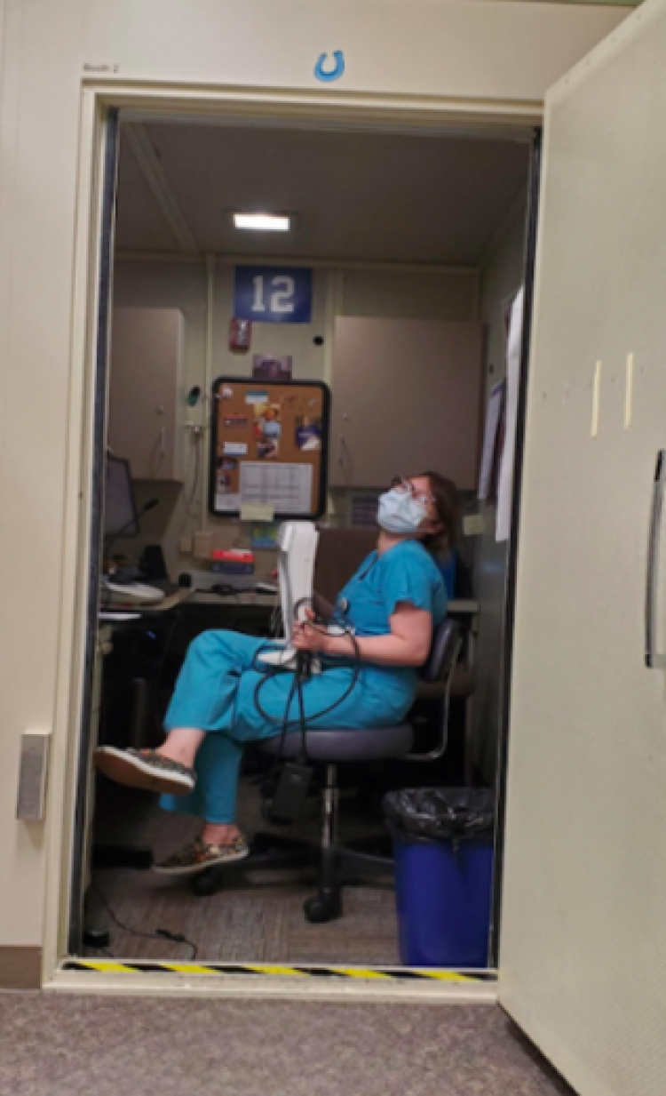 Tabetha Kabler 4th year audiology student in a audiology booth