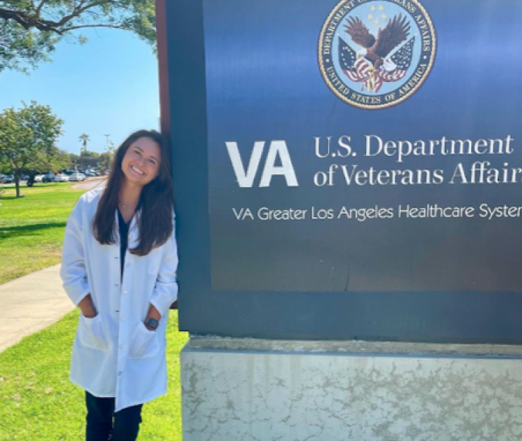 Emily Lee a fourth year AuD student in front of Greater Los Angeles Department of Veteran Affairs (VA)