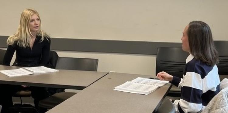 Two students discussing ASL