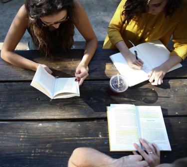 People discussing a book