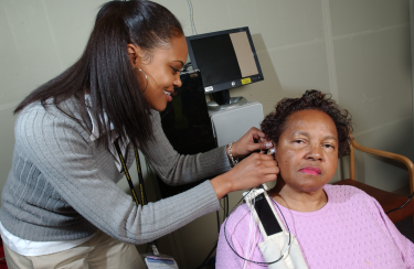 Woman testing ladys hearing