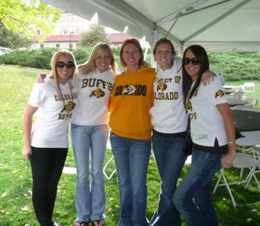 Girls standing under tent
