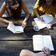 People discussing a book