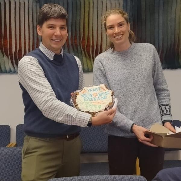 Heather giving Kyle his exit talk cake!