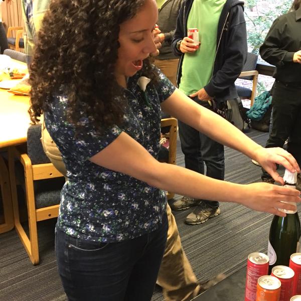 Julia popping the champagne after her exit talk, 2017