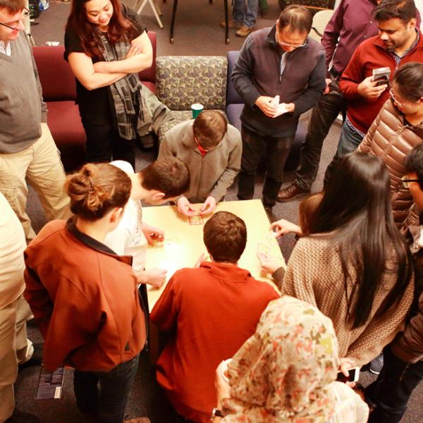 solving puzzles during a holiday party in fall 2015