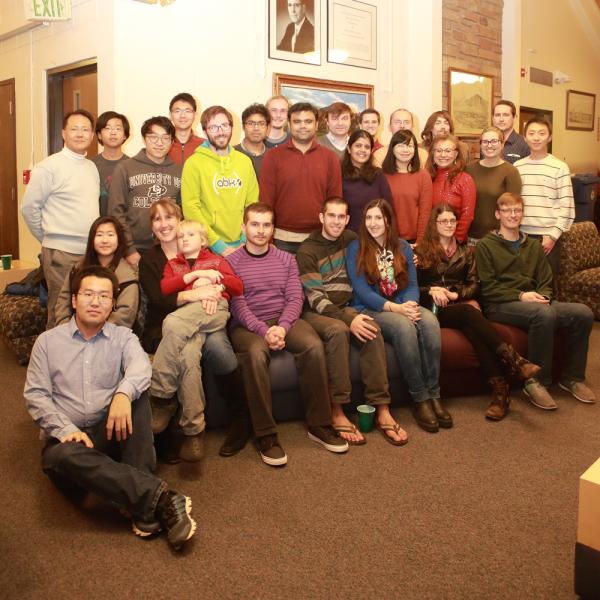 a group photo at a holidays party in december of 2016