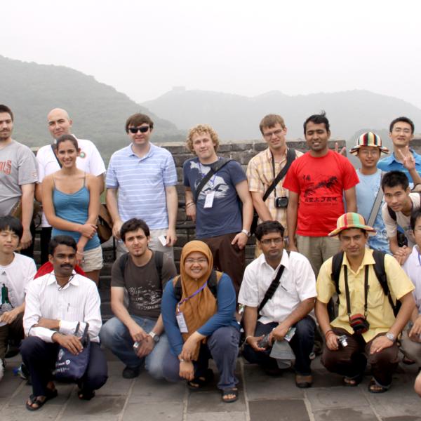 Photo of group members and other attendees at the Great Wall of China in 2009