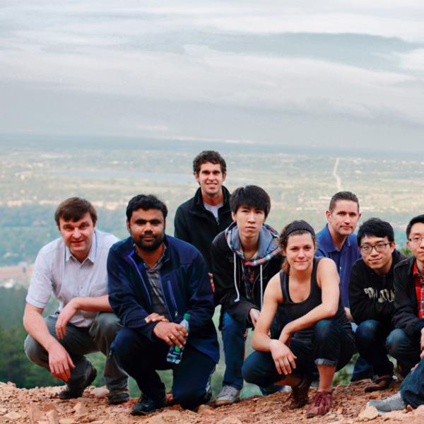 members exhousted on the top of the mountain during a group hike in spring 2015