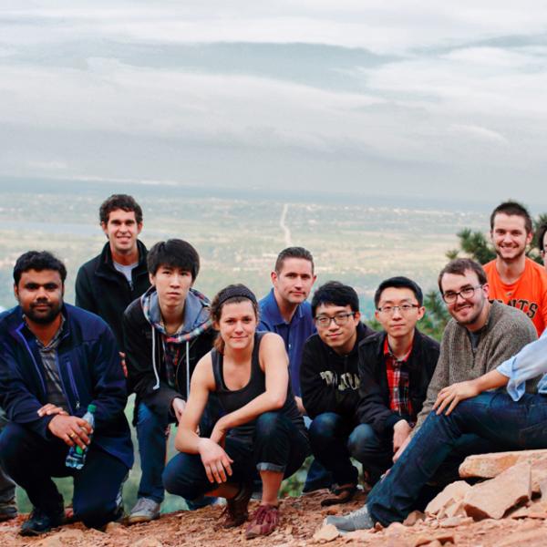 members exhousted on the top of the mountain during a group hike in spring 2015