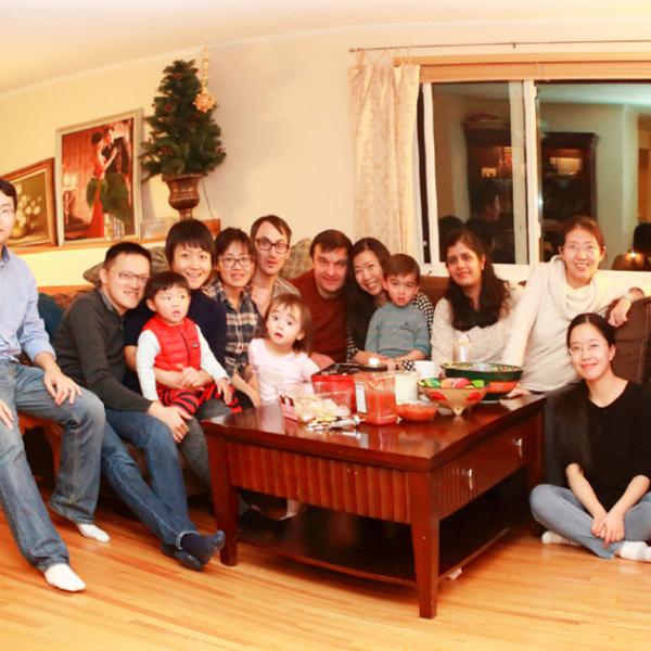 members at the table during a New Year party in winter 2016