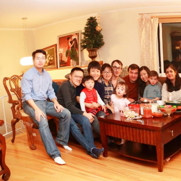 members at the table during a holiday party in winter 2016