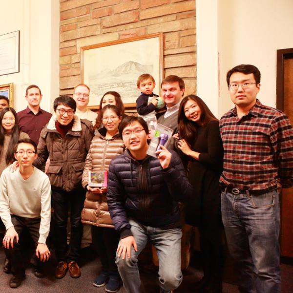a group photo during a holiday party in fall 2015