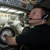 NASA astronaut Terry Virts manipulating a BioServe experiment on ISS
