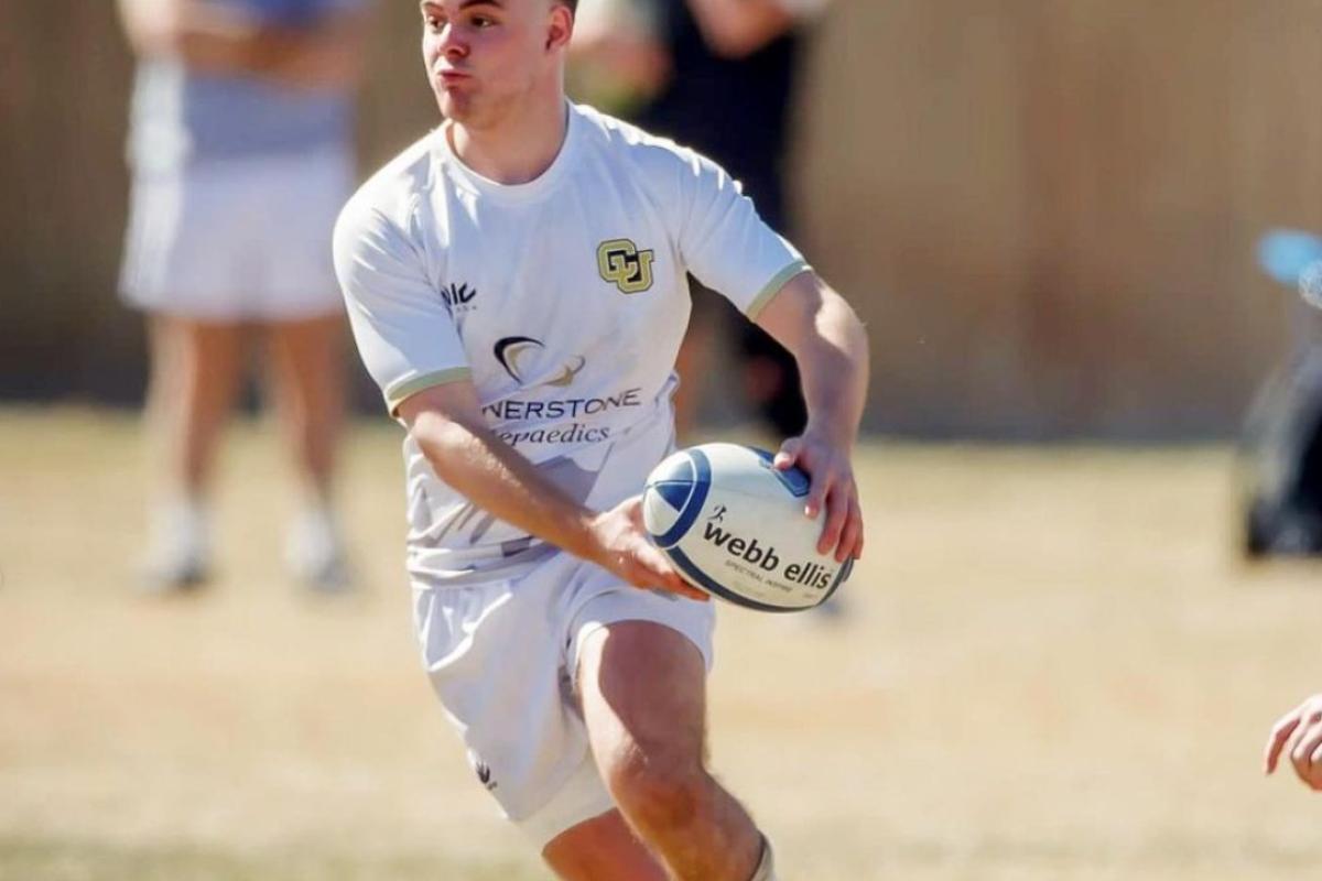 CU Student playing rugby