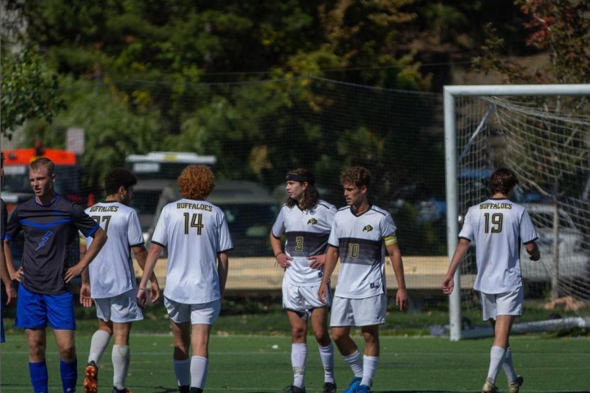CU Men's Soccer team on field