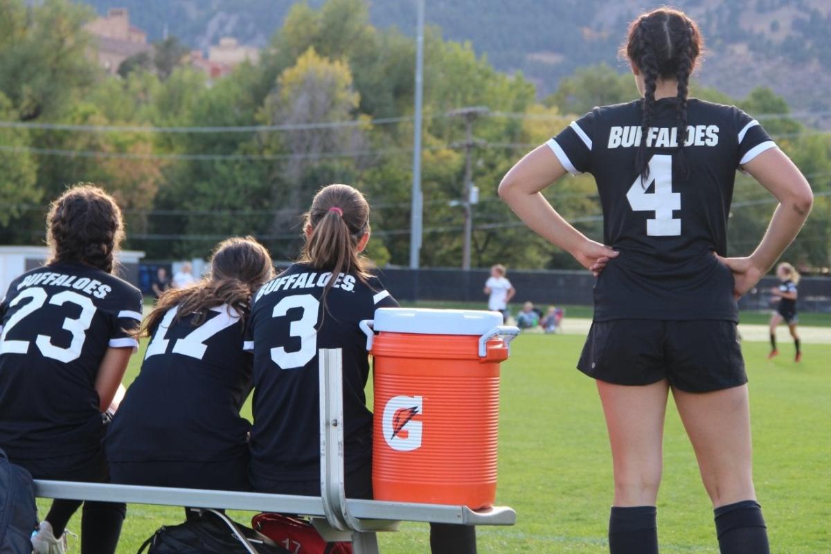 CU Women's Soccer team on the field