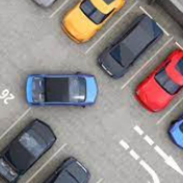 multiple cars parked in a lot
