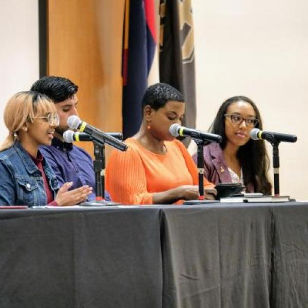 Diversity speakers sitting at a table