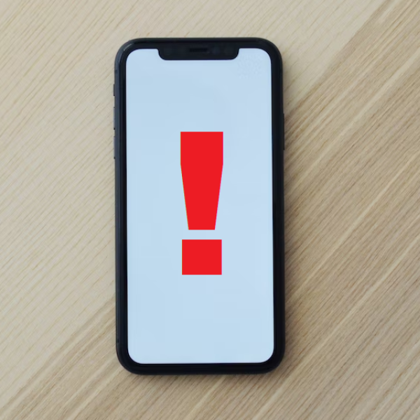 Cell phone with exclamation point on screen