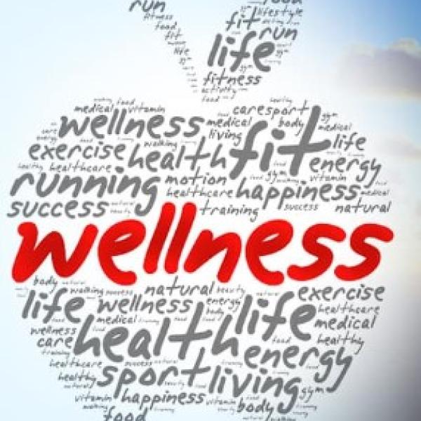 Word bubble in shape of apple highlighting Wellness