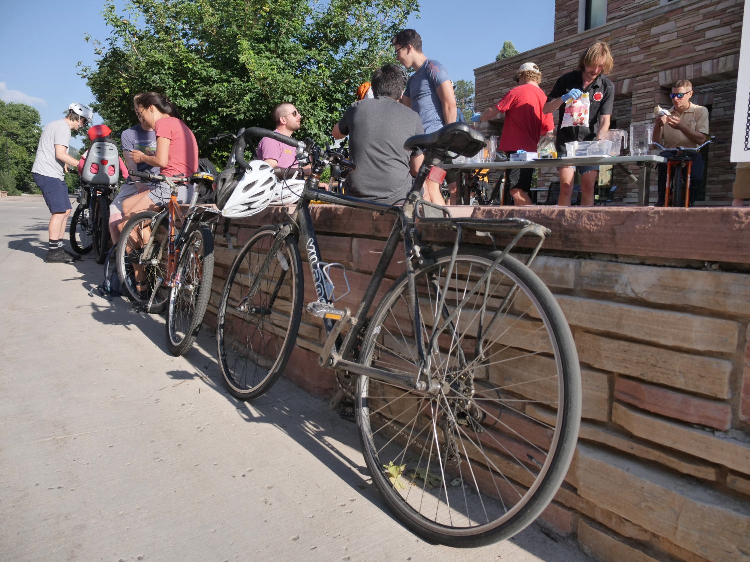 Bicycles leaning against a brick wall