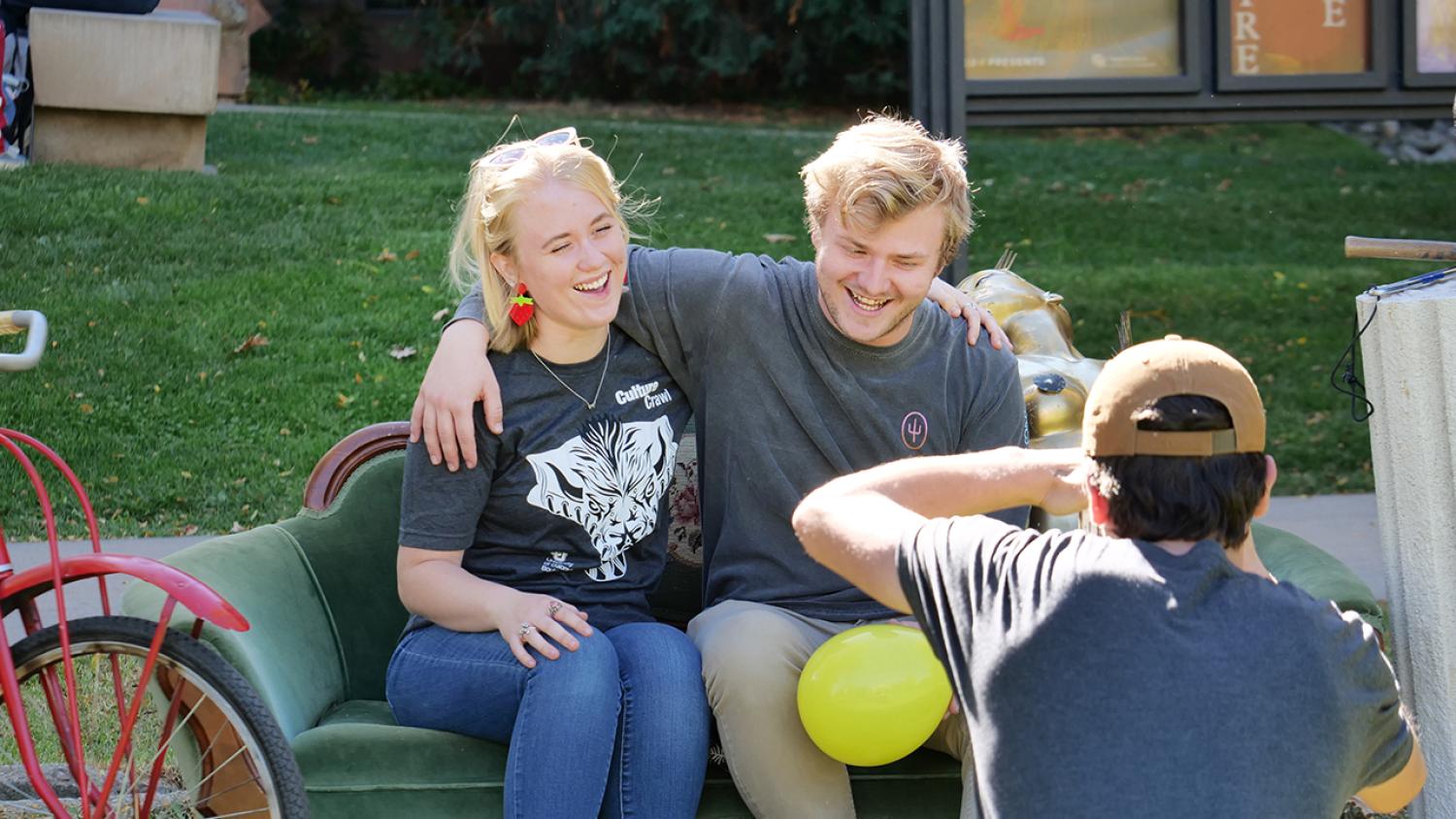 A male and female student having their picture taken