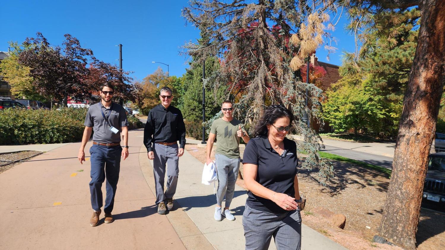 CU Boulder staff casually walking on campus