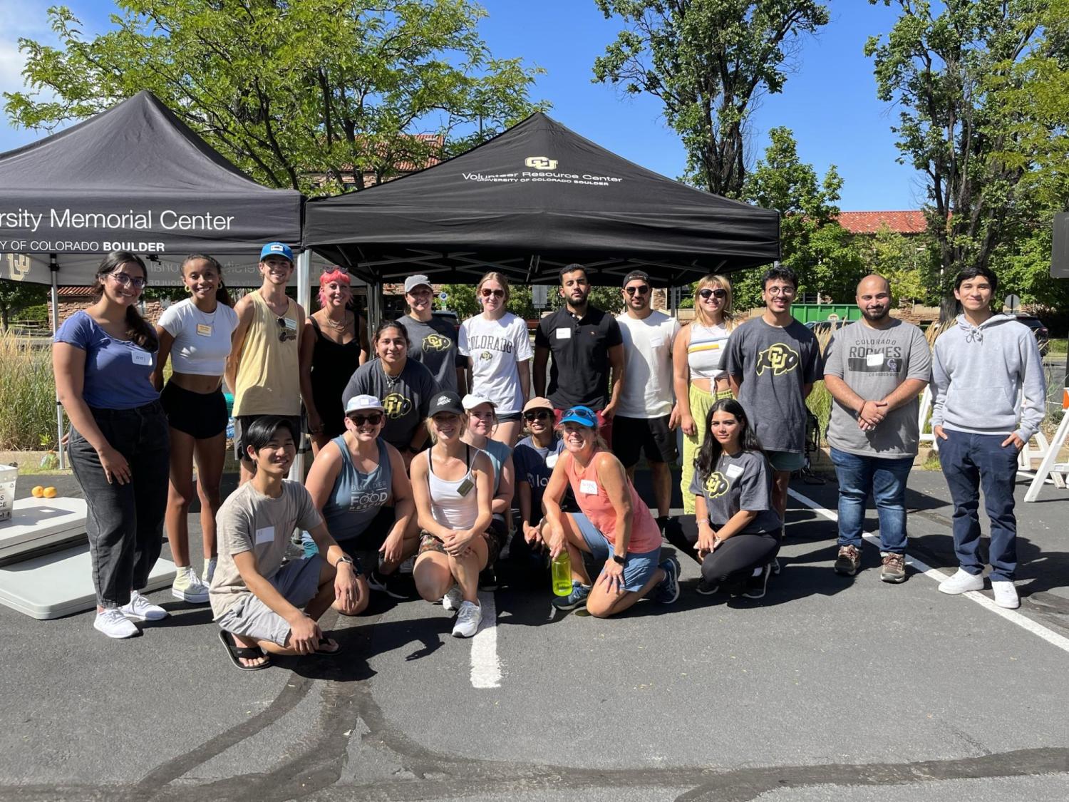 Staff and students lined up and smiling after a successful Mobile Food Pantry shift