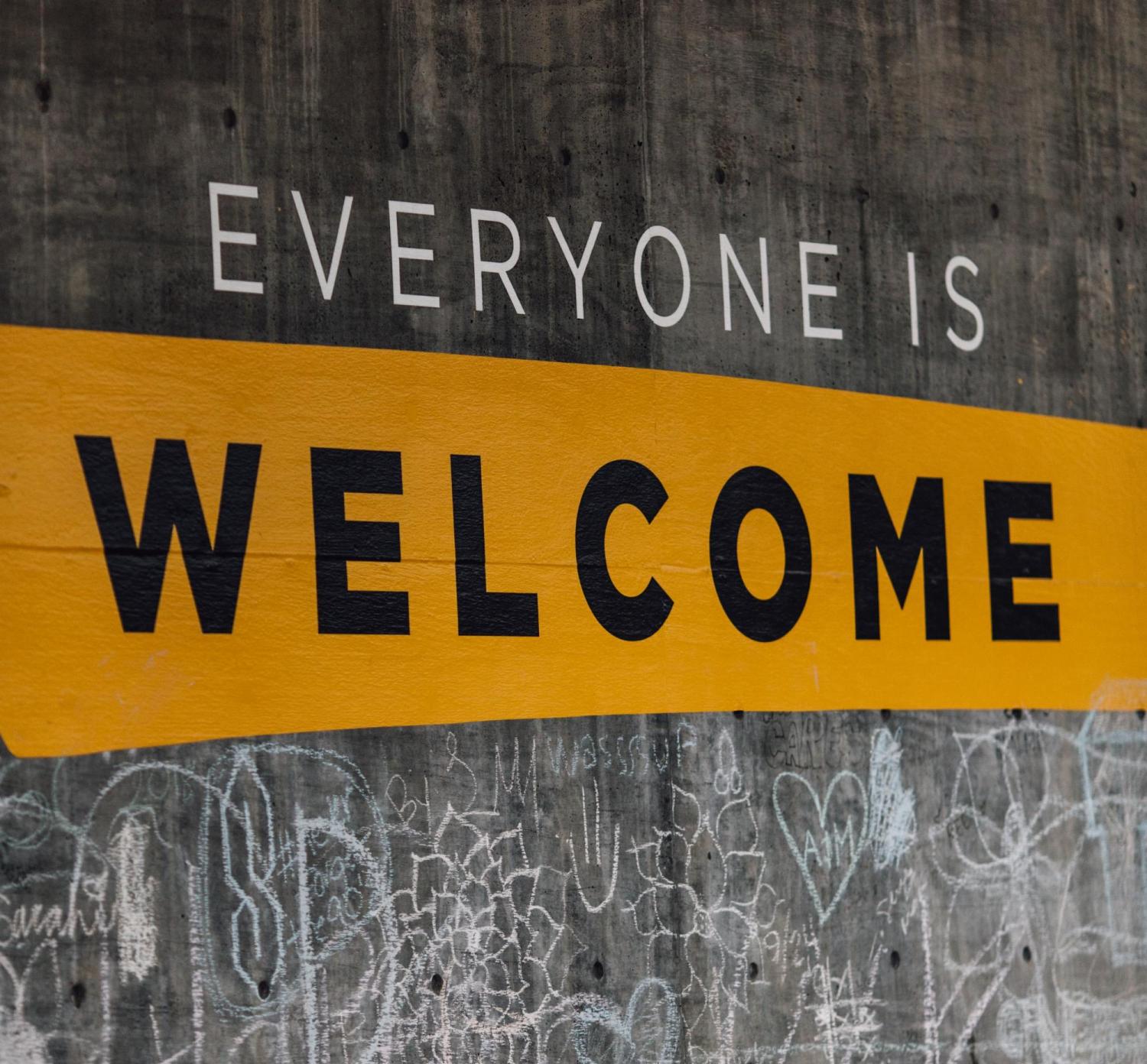 Wall with "Everyone is welcome" written on it