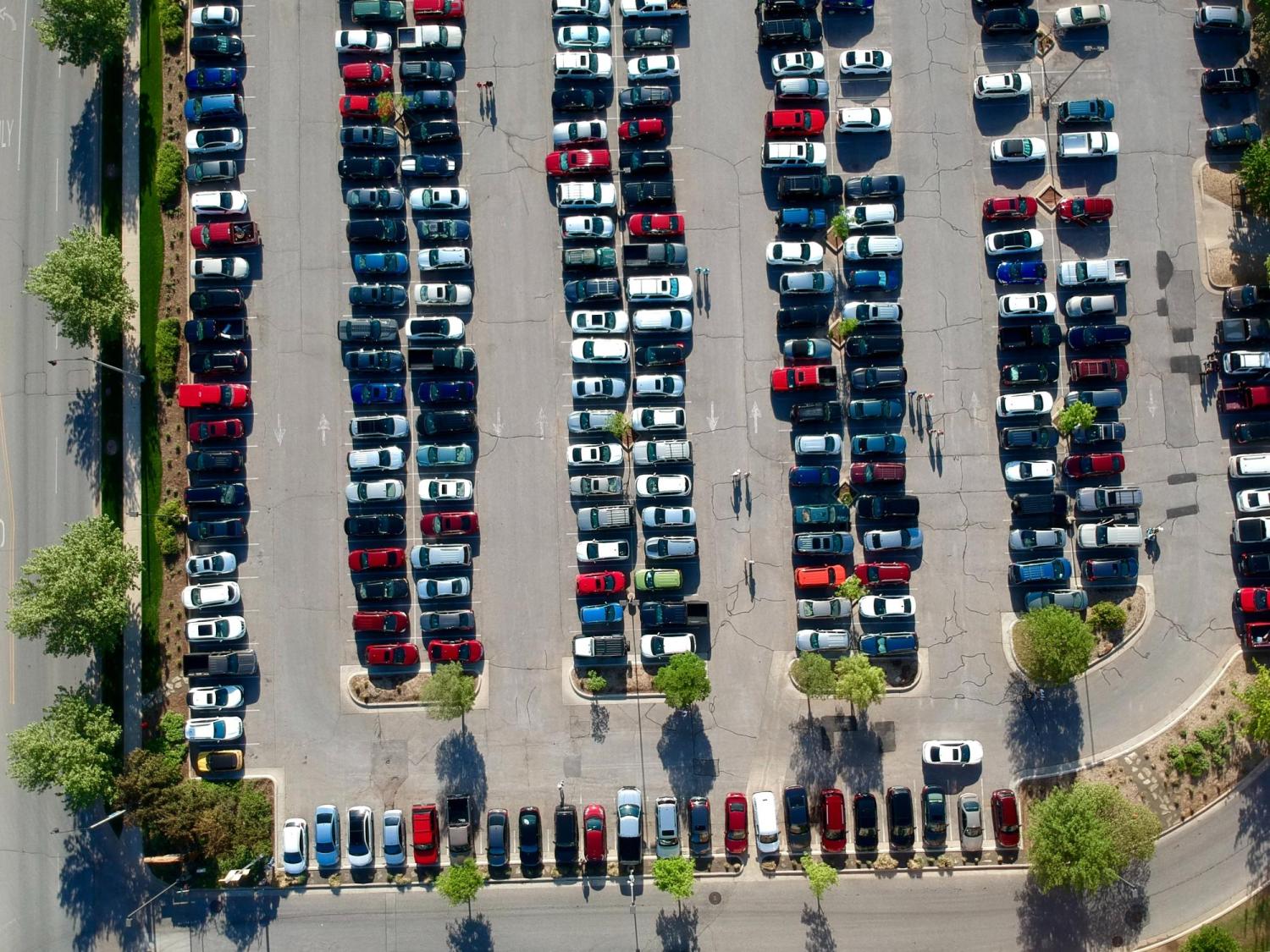 Aerial view of parking lot full of cars