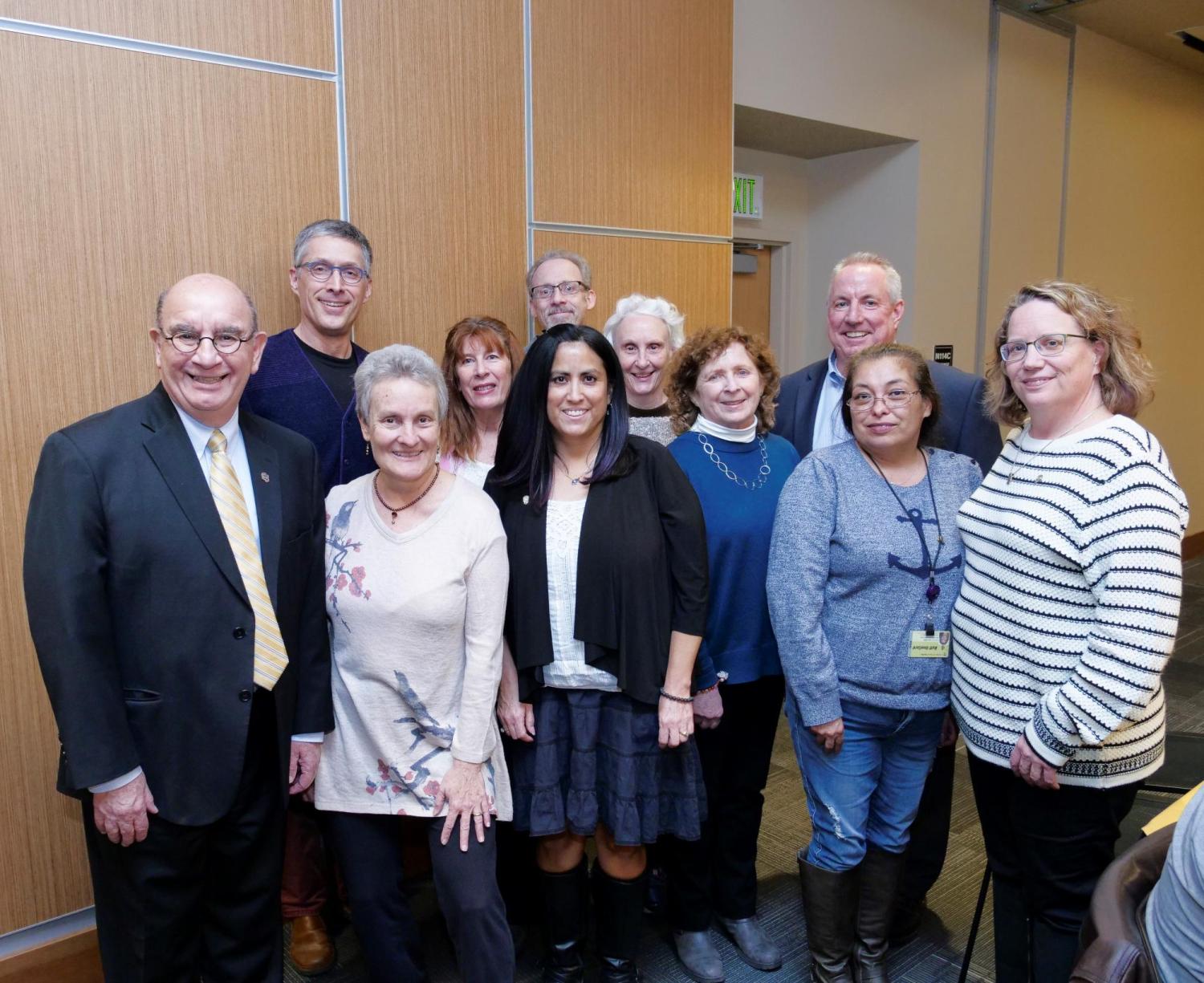 A group of honorees taking a picture with Chancellor DiStefano at the 2019 Years of Service event