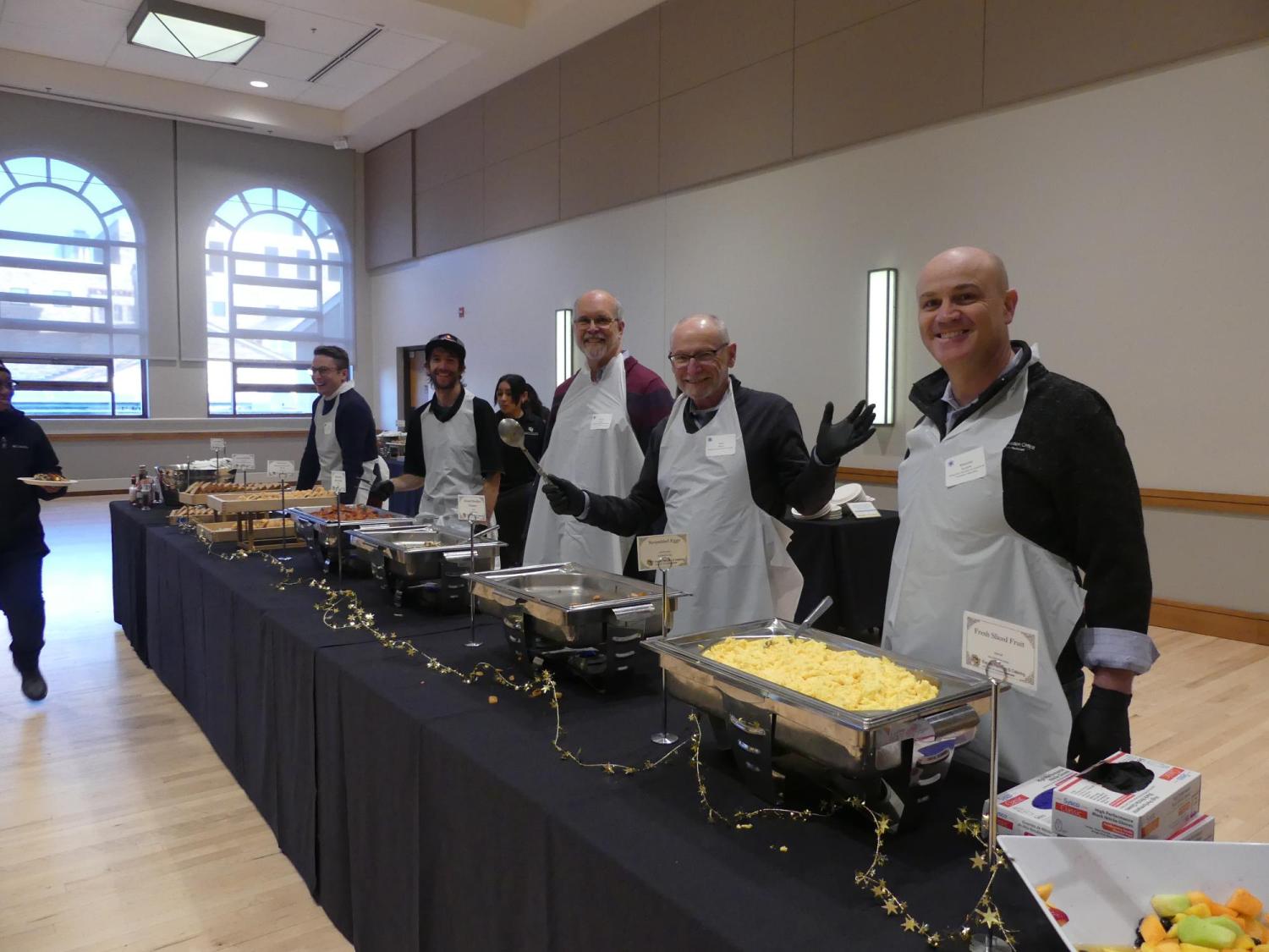 CU Leadership serving breakfast