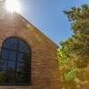 Exterior Shot of CU Building with sun shining 