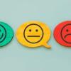 3 emojis in talk bubbles (Green - Smile, Yellow - Neutral, red - frown)