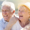 senior couple hugging eachother and smiling