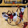 Overhead view of CU basketball players an opponents around the net