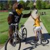 Chip and girl on bike hi-fiving