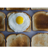 Slices of toast and an over easy egg