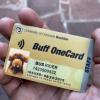 Close up view of someone with a buff one card in their hand