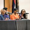 Diversity speakers sitting at a table