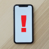 Cell phone with exclamation point on screen