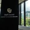 Staff Council banner adjacent to window overlooking flatirons
