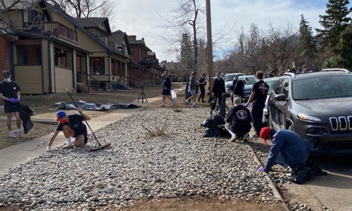 students helping to clean up on The Hill