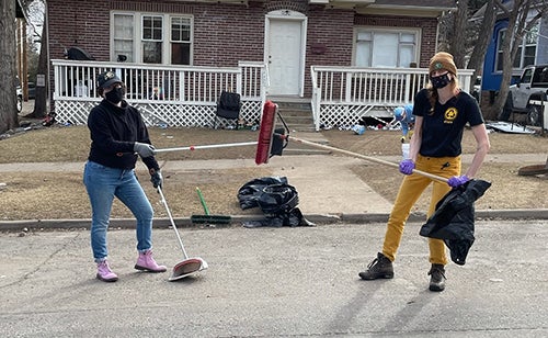 students helping to clean up on The Hill