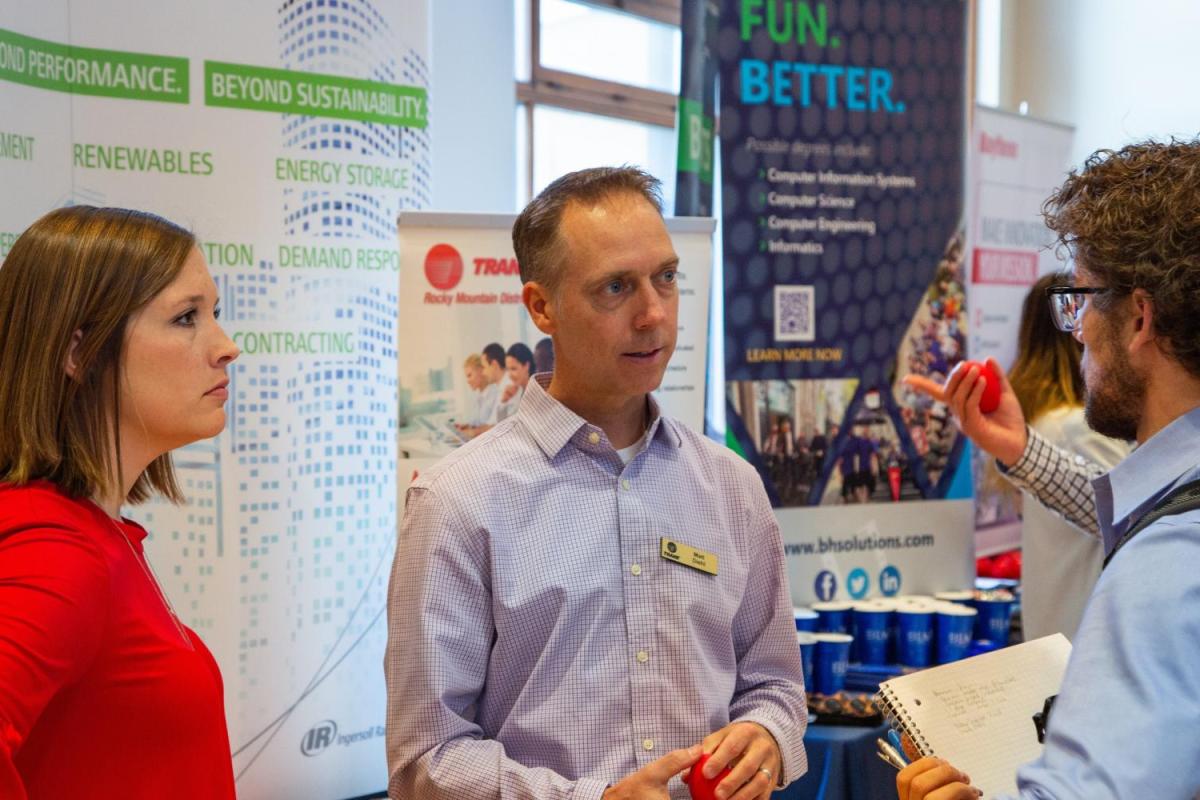 Student talking to an employer at the career fair
