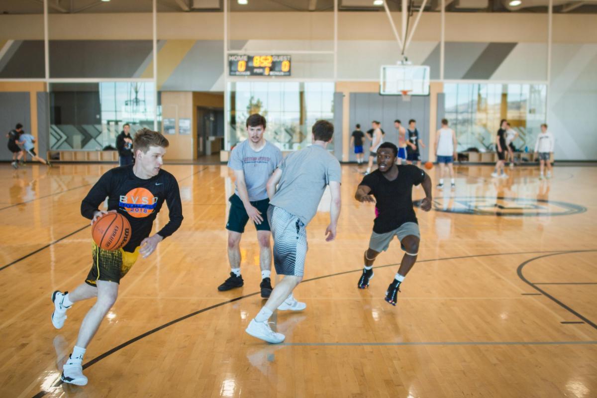 People playing basketball indoors