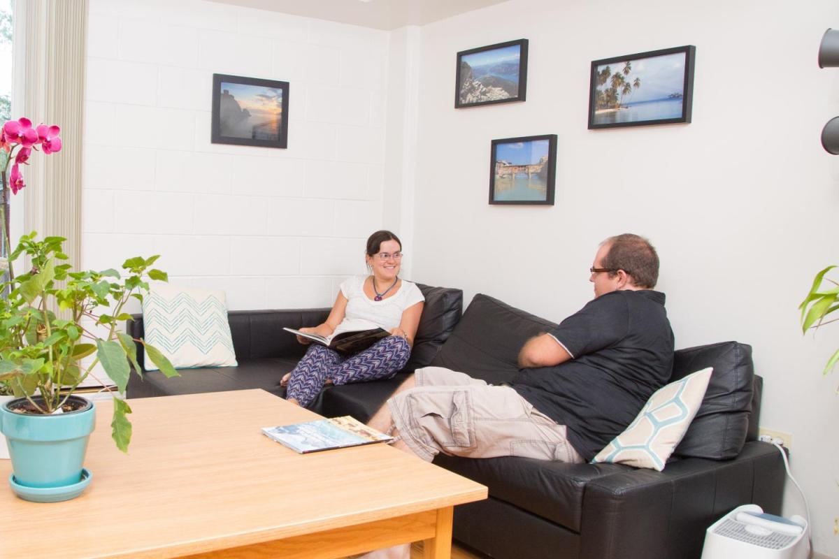Two people lounging in their living room