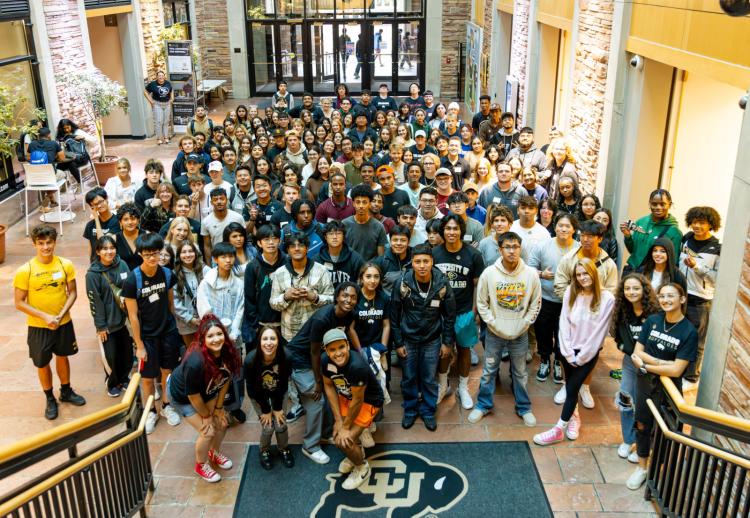 large group of students posing together at UMC