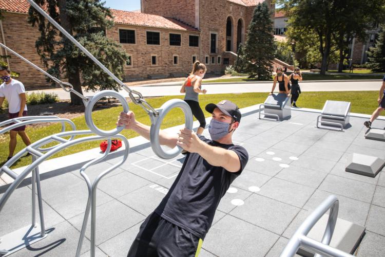 student exercising at the rec center